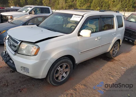 2011 Honda Pilot Touring z USA, uszkodzony, nr VIN 5FNYF4H9XBB095599